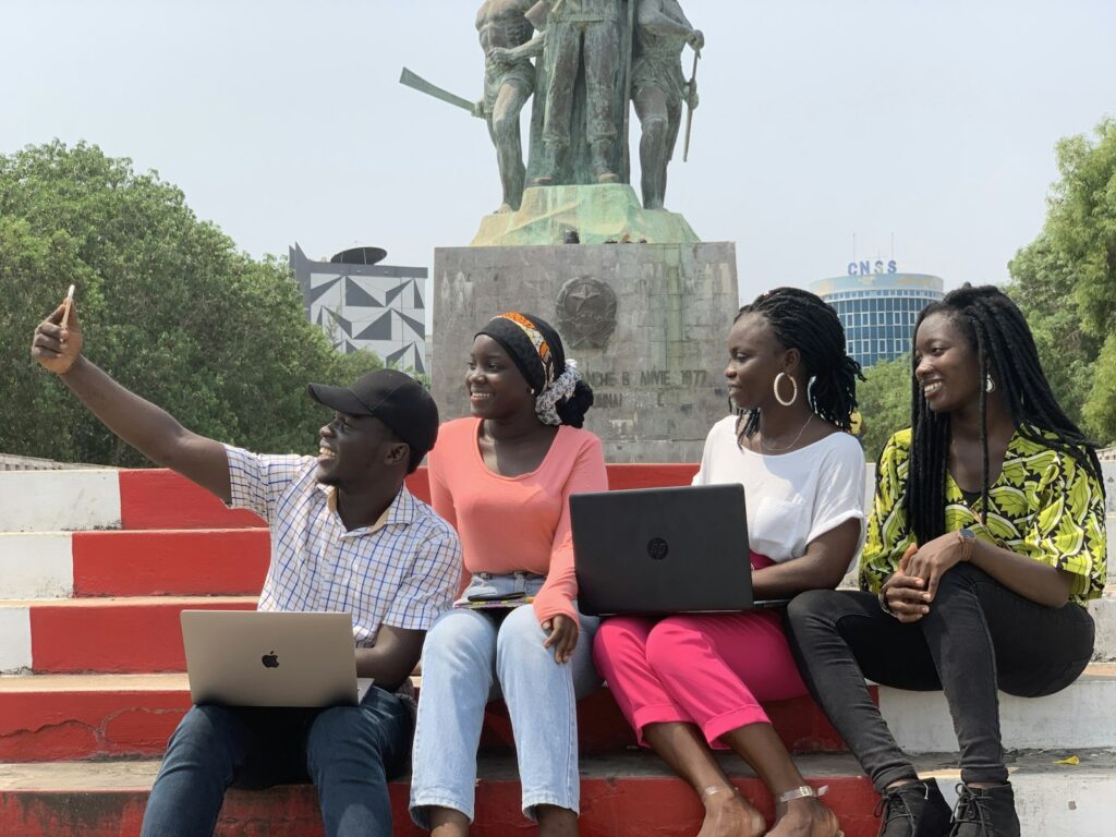 Young people using laptops